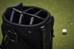 woode top system golf bag on putting green