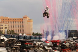 Travis pastrana jumping over 52 crushed cars.
