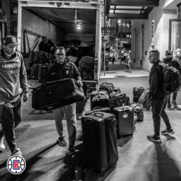 LA Clippers unloading bags from the truck.